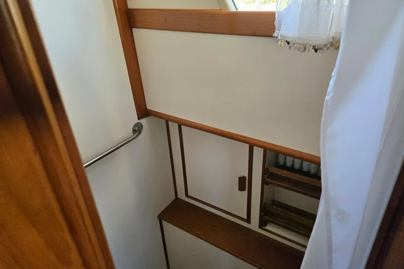 Slide: The Image of Interior of 1992 Grand Banks 46 Classic yacht, featuring wooden cabinetry and nautical decor. - 52