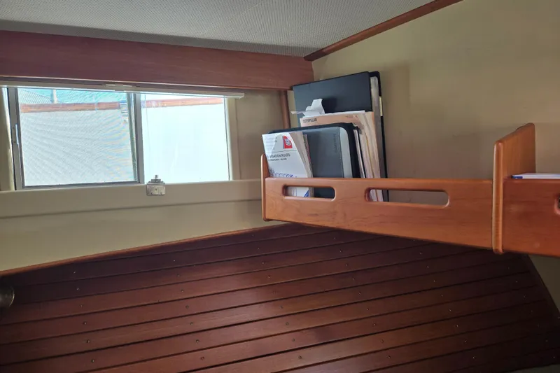 Slide: The Image of Interior of 1992 Grand Banks 46 Classic with wooden shelves and window. - 58