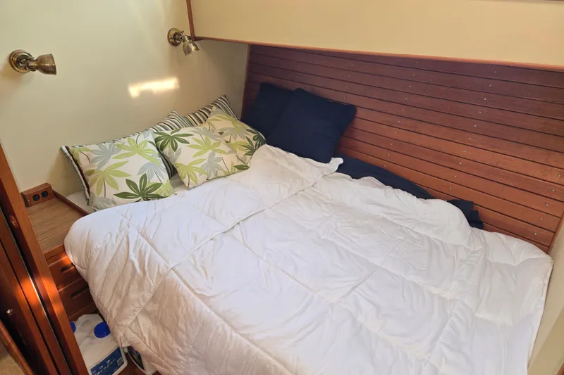 Slide: The Image of Cozy cabin bed with pillows in 1992 Grand Banks 46 Classic yacht. - 60