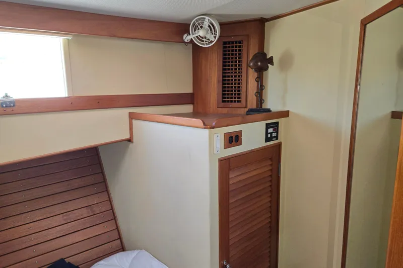 Slide: The Image of Interior cabin of 1992 Grand Banks 46 Classic yacht with wooden accents and ventilation fan. - 61
