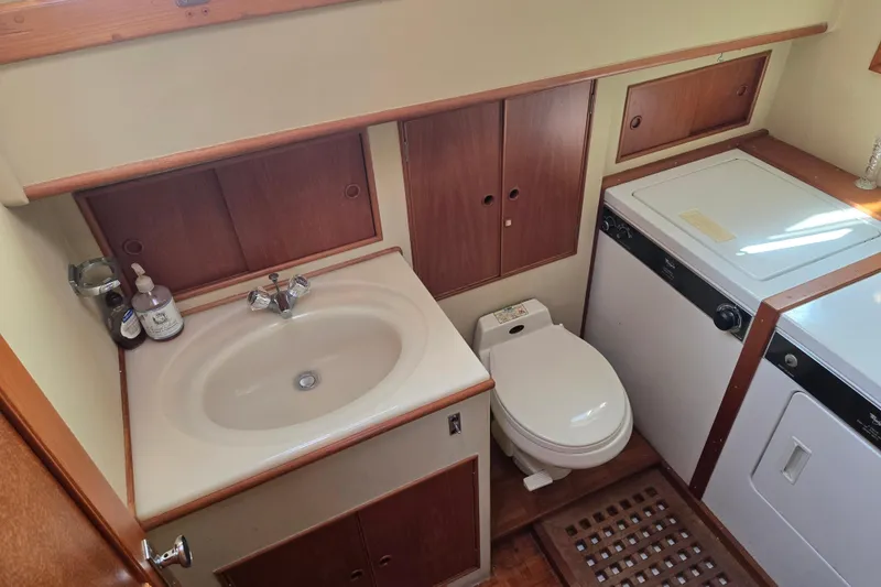 Slide: The Image of Bathroom and laundry area in a 1992 Grand Banks 46 Classic yacht. - 62