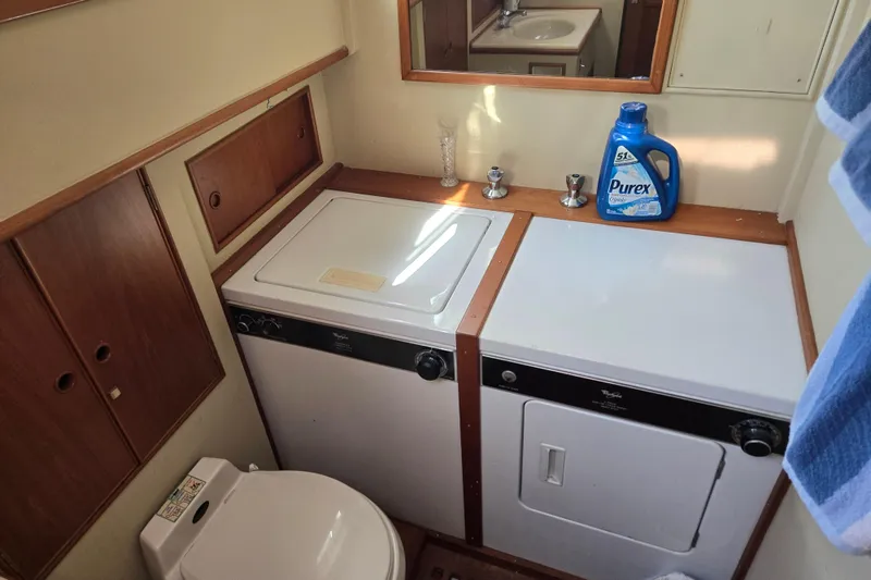 Slide: The Image of Laundry area in 1992 Grand Banks 46 Classic yacht with washer, dryer, and detergent. - 63