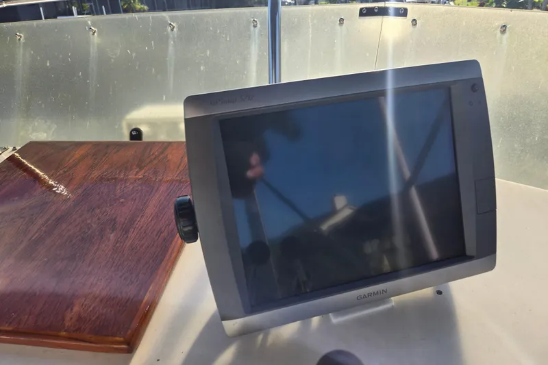 Slide: The Image of Garmin GPS device on 1992 Grand Banks 46 Classic boat dashboard. - 70