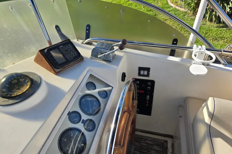 Slide: The Image of Helm of 1992 Grand Banks 46 Classic yacht with gauges and controls. - 71