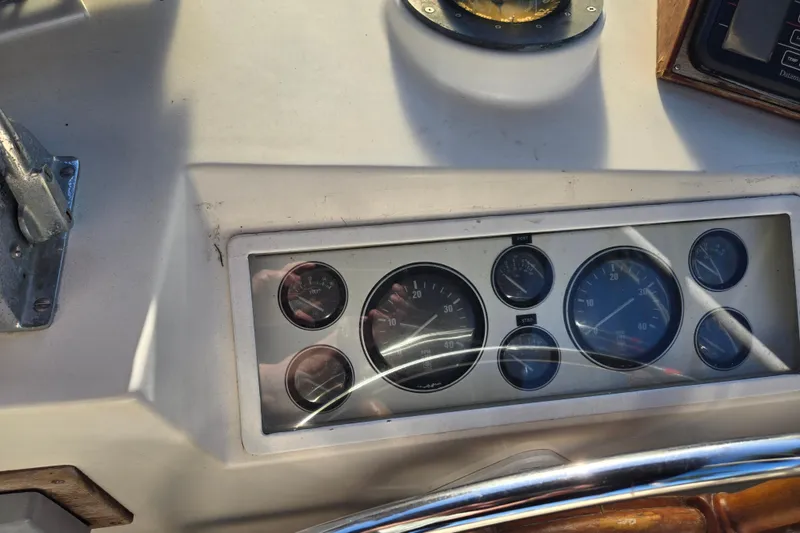 Slide: The Image of Dashboard of a 1992 Grand Banks 46 Classic boat with gauges and controls. - 72