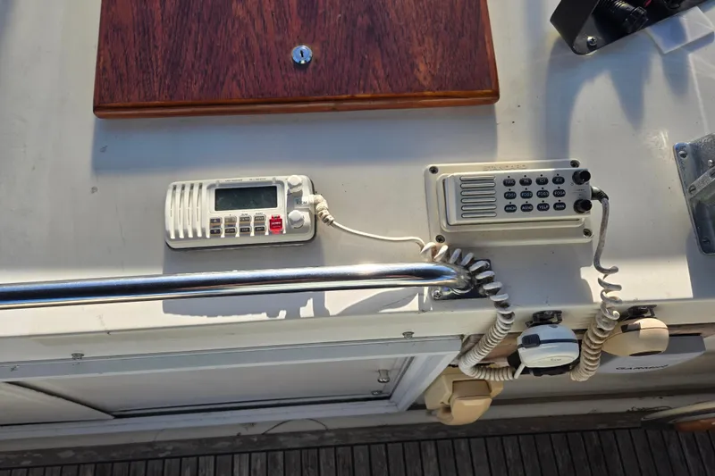 Slide: The Image of Control panel on a 1992 Grand Banks 46 Classic yacht, featuring communication devices. - 73