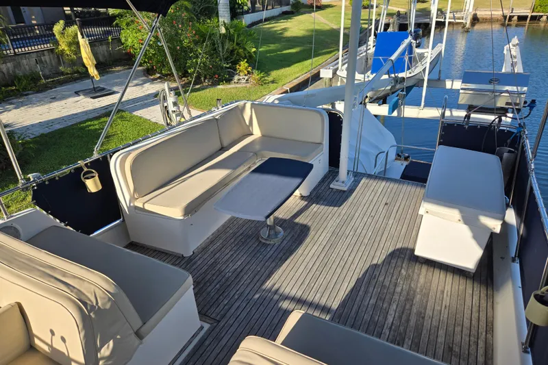 Slide: The Image of Spacious deck of 1992 Grand Banks 46 Classic yacht with comfortable seating and table. - 79