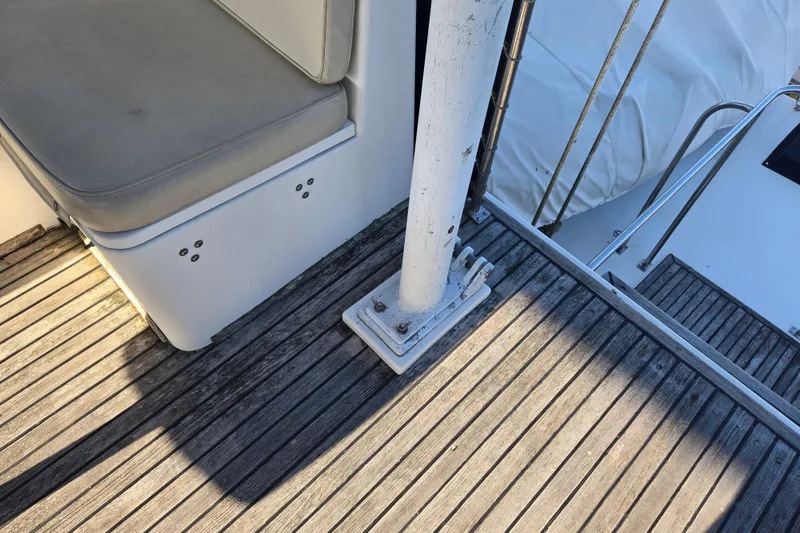 Slide: The Image of Deck area of a 1992 Grand Banks 46 Classic yacht with wooden flooring and seating. - 84