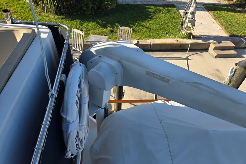 Slide: The Image of Deck view of a 1992 Grand Banks 46 Classic yacht with lifebuoy and davit. - 86