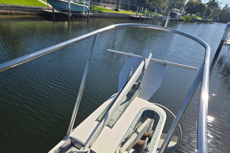 Slide: The Image of Bow view of 1992 Grand Banks 46 Classic yacht on calm waterway. - 95