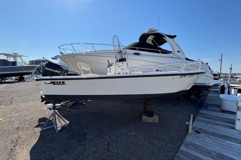 The Image of 2006 Mako 171 Center Console boat on display at a marina. - 0