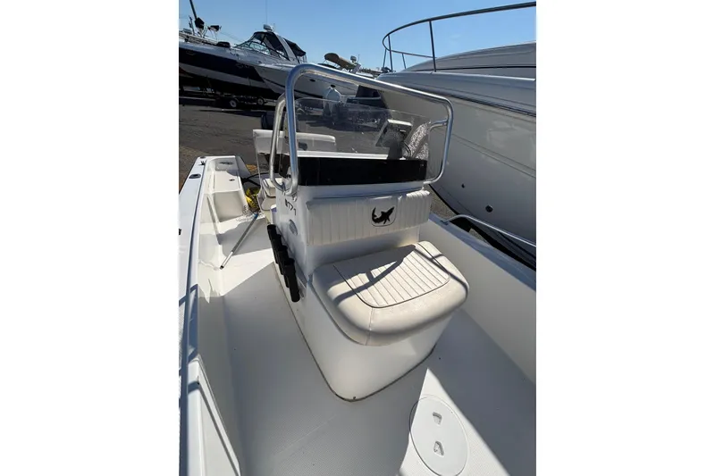 Slide: The Image of 2006 Mako 171 Center Console boat interior with seating and steering console. - 16