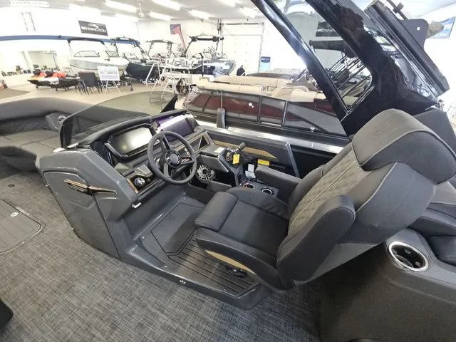 Slide: The Image of Interior of 2026 Godfrey Sanpan 2500 SBC with luxurious helm station. - 10