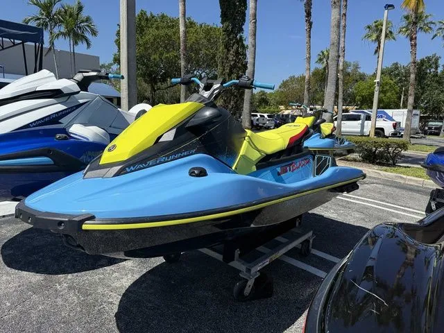 Slide: The Image of 2022 Yamaha WaveRunner JetBlaster in blue and yellow, parked outdoors. - 3