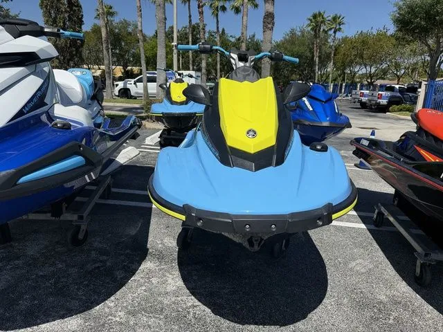 Slide: The Image of 2022 Yamaha WaveRunner JetBlaster in blue and yellow on parking lot. - 4