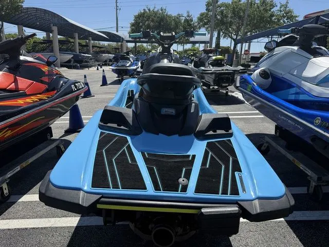 Slide: The Image of 2022 Yamaha WaveRunner JetBlaster in blue on a parking lot. - 6