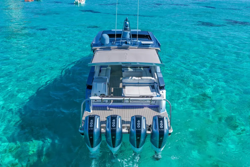 Slide: The Image of 2025 Formula 430 Super Sport Crossover on clear turquoise water, showcasing powerful engines. - 10