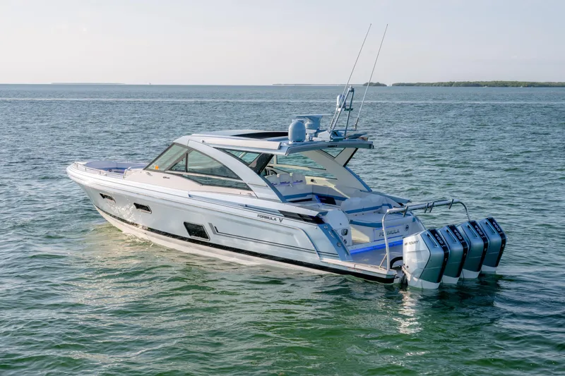 Slide: The Image of 2025 Formula 430 Super Sport Crossover boat cruising on open water. - 101