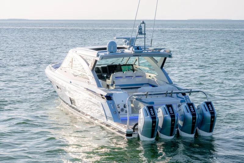 Slide: The Image of 2025 Formula 430 Super Sport Crossover boat on open water, featuring four powerful engines. - 103