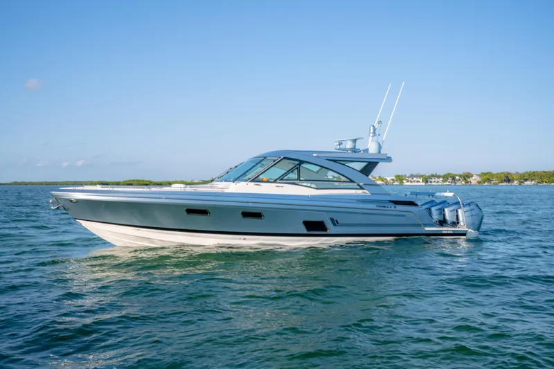 Slide: The Image of 2025 Formula 430 Super Sport Crossover cruising on open water under clear blue skies. - 107