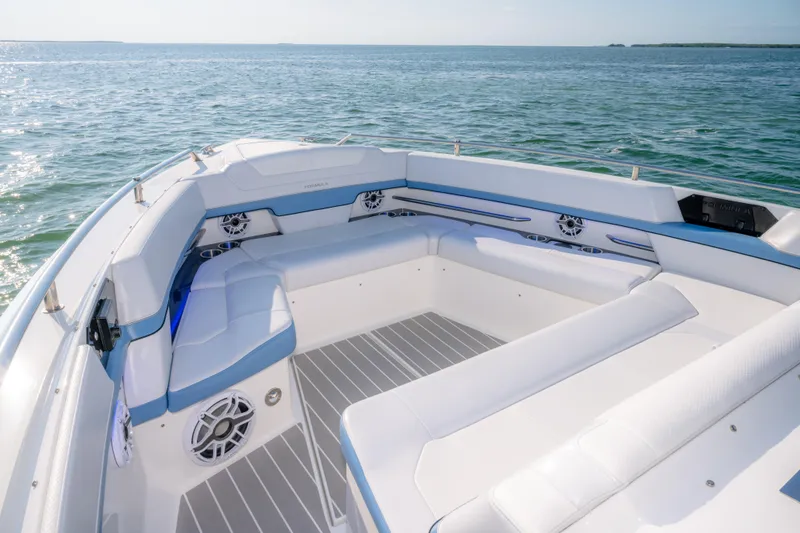 Slide: The Image of Luxurious seating on 2025 Formula 430 Super Sport Crossover boat, overlooking serene ocean waters. - 13