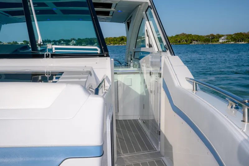 Slide: The Image of 2025 Formula 430 Super Sport Crossover yacht interior with sleek design on open water. - 16