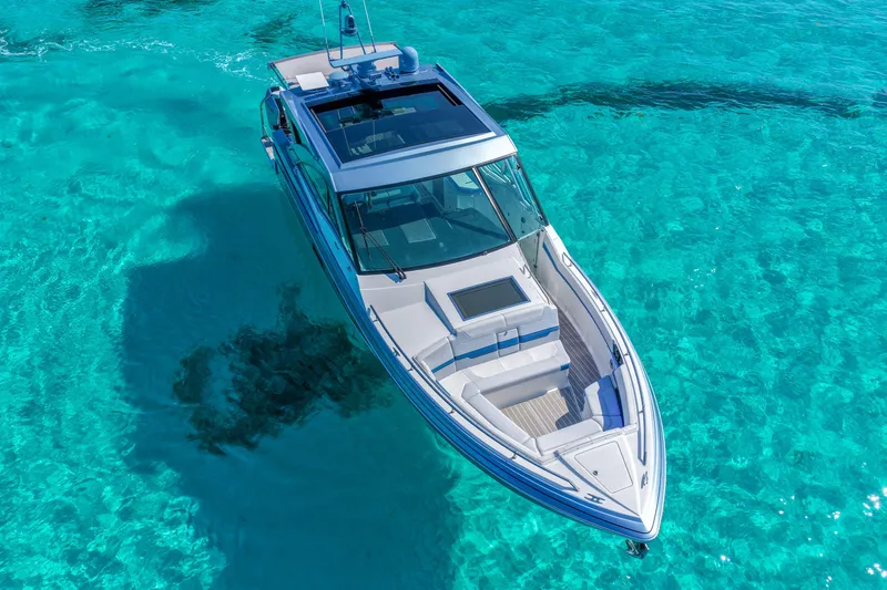 Slide: The Image of 2025 Formula 430 Super Sport Crossover on clear turquoise water, aerial view. - 2