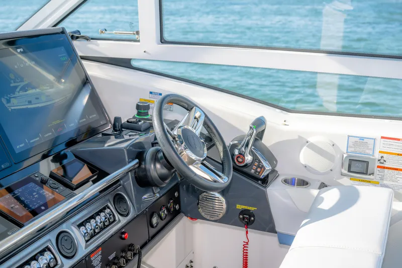 Slide: The Image of Helm of 2025 Formula 430 Super Sport Crossover with advanced navigation controls. - 24
