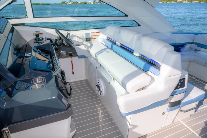 Slide: The Image of 2025 Formula 430 Super Sport Crossover interior with luxurious seating and modern helm. - 27