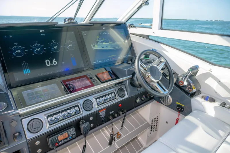 Slide: The Image of Helm of 2025 Formula 430 Super Sport Crossover with advanced navigation displays. - 28