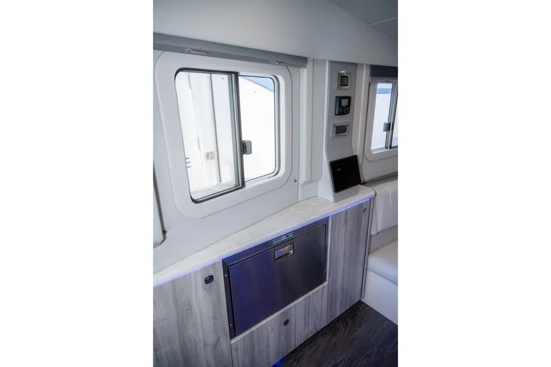 Slide: The Image of Interior of 2025 Formula 430 Super Sport Crossover, featuring modern cabinetry and sleek design. - 33