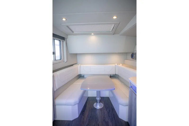 Slide: The Image of Interior of 2025 Formula 430 Super Sport Crossover with modern seating and table. - 40