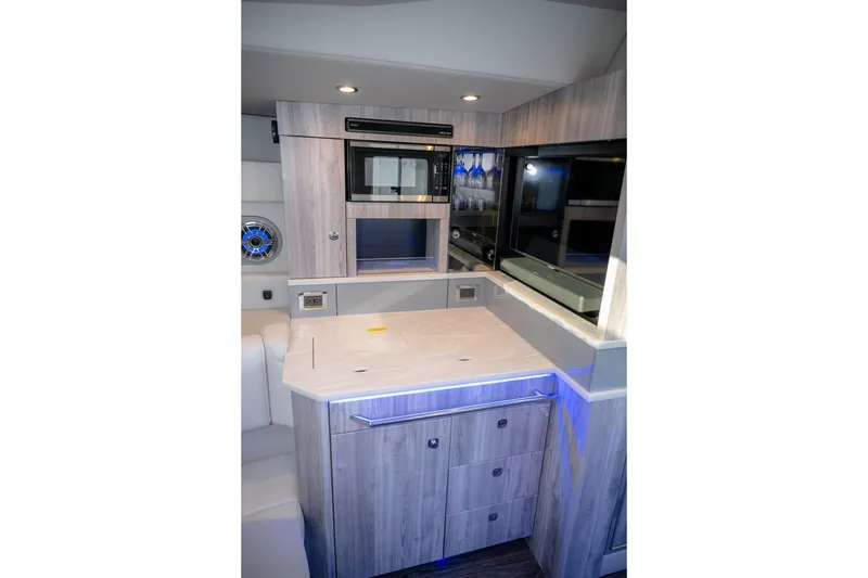 Slide: The Image of Interior of 2025 Formula 430 Super Sport Crossover with modern kitchen amenities. - 42