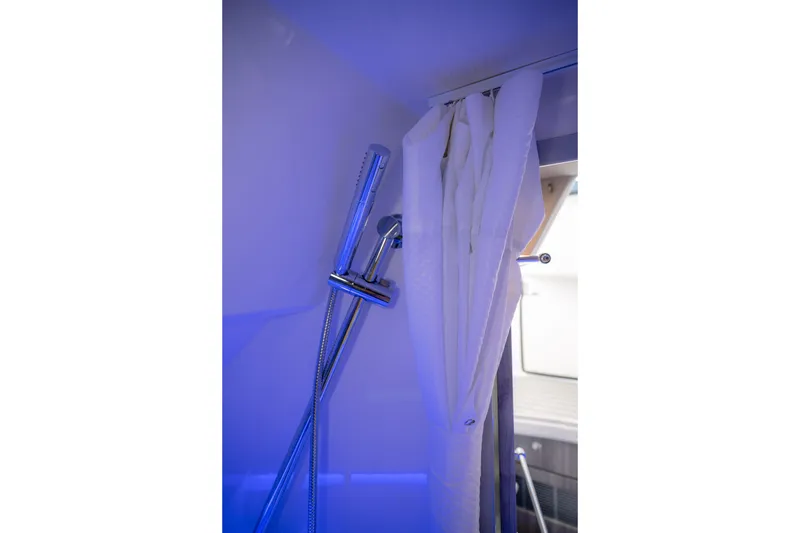 Slide: The Image of Shower area in 2025 Formula 430 Super Sport Crossover with modern fixtures and curtain. - 46