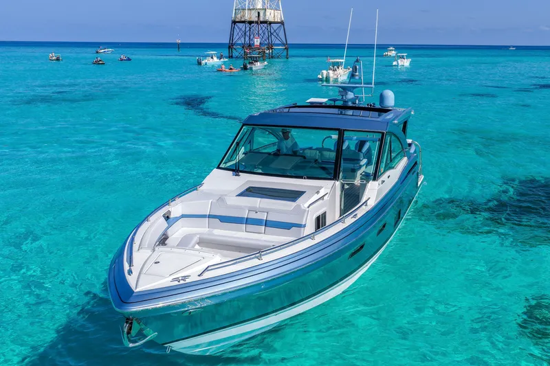 Slide: The Image of 2025 Formula 430 Super Sport Crossover cruising in clear turquoise waters. - 5
