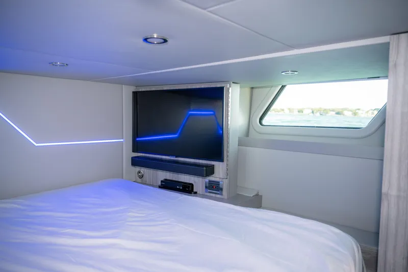 Slide: The Image of Luxurious interior of 2025 Formula 430 Super Sport Crossover with modern TV and ambient lighting. - 50
