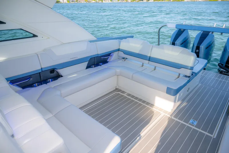 Slide: The Image of Luxurious seating on 2025 Formula 430 Super Sport Crossover yacht, overlooking serene waters. - 53