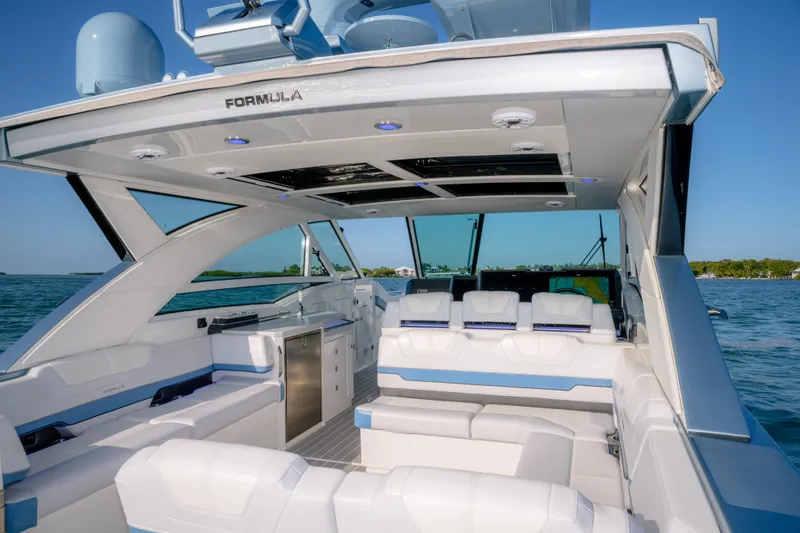 Slide: The Image of 2025 Formula 430 Super Sport Crossover luxury yacht interior with sleek seating and modern design. - 57