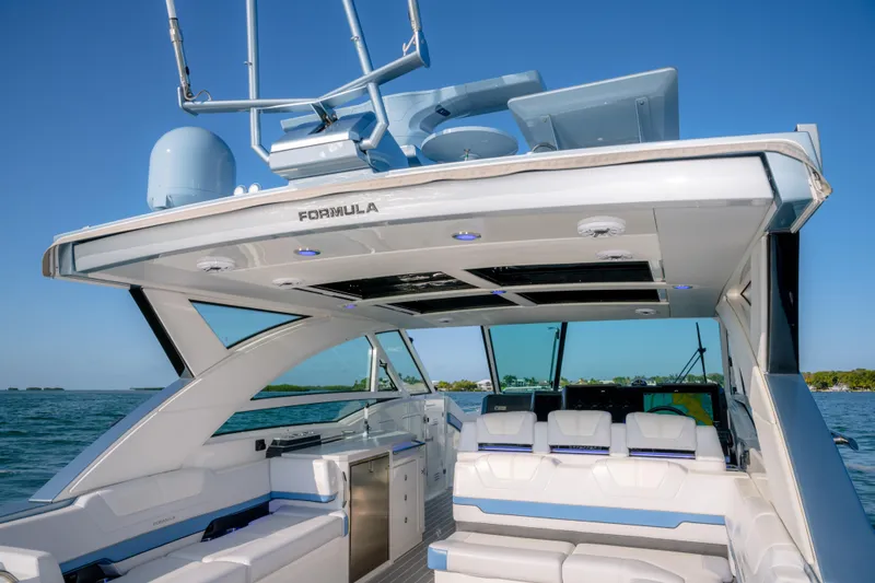 Slide: The Image of 2025 Formula 430 Super Sport Crossover luxury yacht interior with sleek design and ocean backdrop. - 58