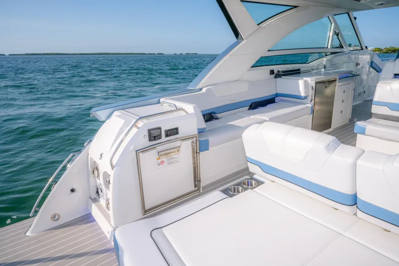 Slide: The Image of 2025 Formula 430 Super Sport Crossover yacht interior with luxurious seating and ocean view. - 60
