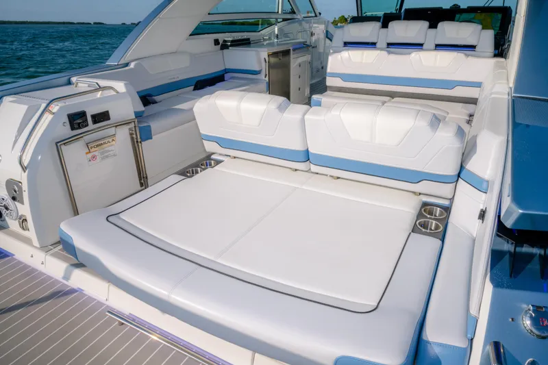 Slide: The Image of 2025 Formula 430 Super Sport Crossover boat interior with luxurious seating and cup holders. - 65