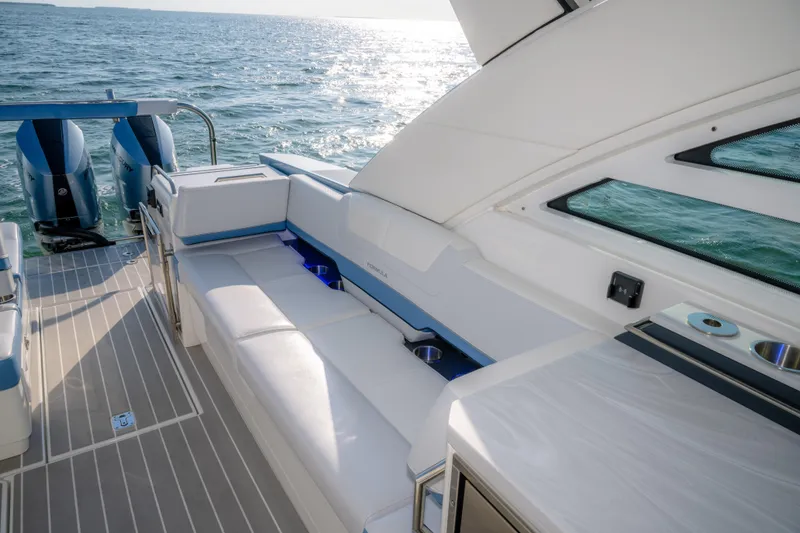 Slide: The Image of Luxury seating on 2025 Formula 430 Super Sport Crossover yacht, overlooking ocean. - 67