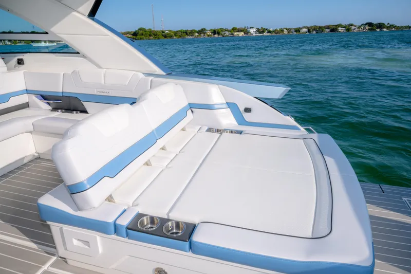 Slide: The Image of Luxury seating on 2025 Formula 430 Super Sport Crossover yacht, overlooking serene blue waters. - 69