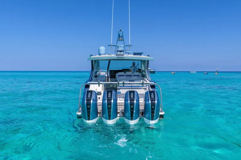 Slide: The Image of 2025 Formula 430 Super Sport Crossover in clear blue ocean waters. - 7