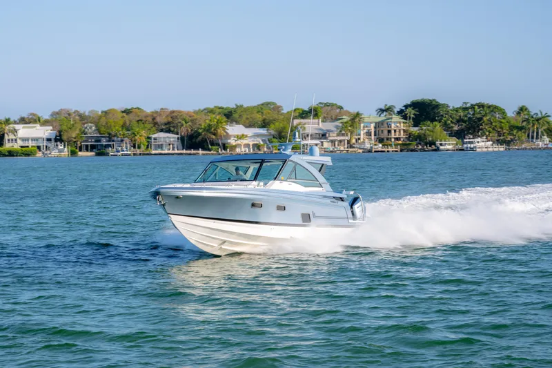 Slide: The Image of 2025 Formula 430 Super Sport Crossover cruising on a scenic waterway. - 73