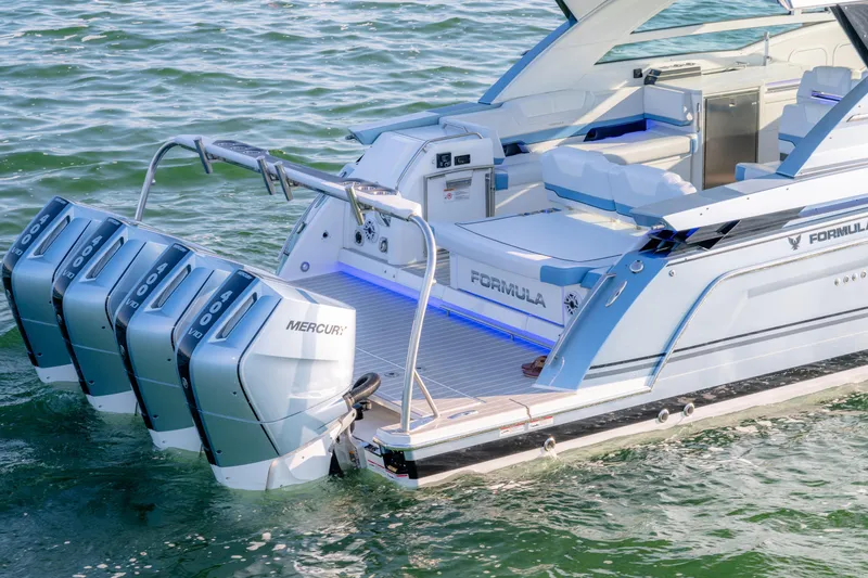 Slide: The Image of 2025 Formula 430 Super Sport Crossover boat with Mercury engines on water. - 80