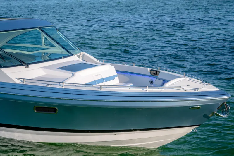 Slide: The Image of 2025 Formula 430 Super Sport Crossover boat on clear blue water. - 85