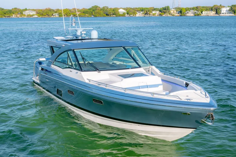 Slide: The Image of 2025 Formula 430 Super Sport Crossover boat on serene water. - 86