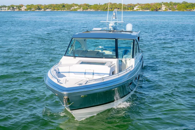 Slide: The Image of 2025 Formula 430 Super Sport Crossover cruising on clear blue water. - 88