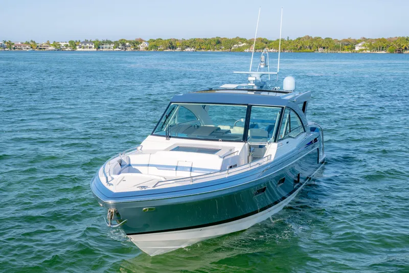 Slide: The Image of 2025 Formula 430 Super Sport Crossover yacht cruising on clear blue water. - 89